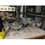 A QUANTITY OF WINE GLASSES PLUS A FOOTED BOWL, LARGE FASHION HANDBAG AND A DESK LAMP