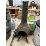 A DECORATIVE CAST IRON GARDEN CHIMENEA