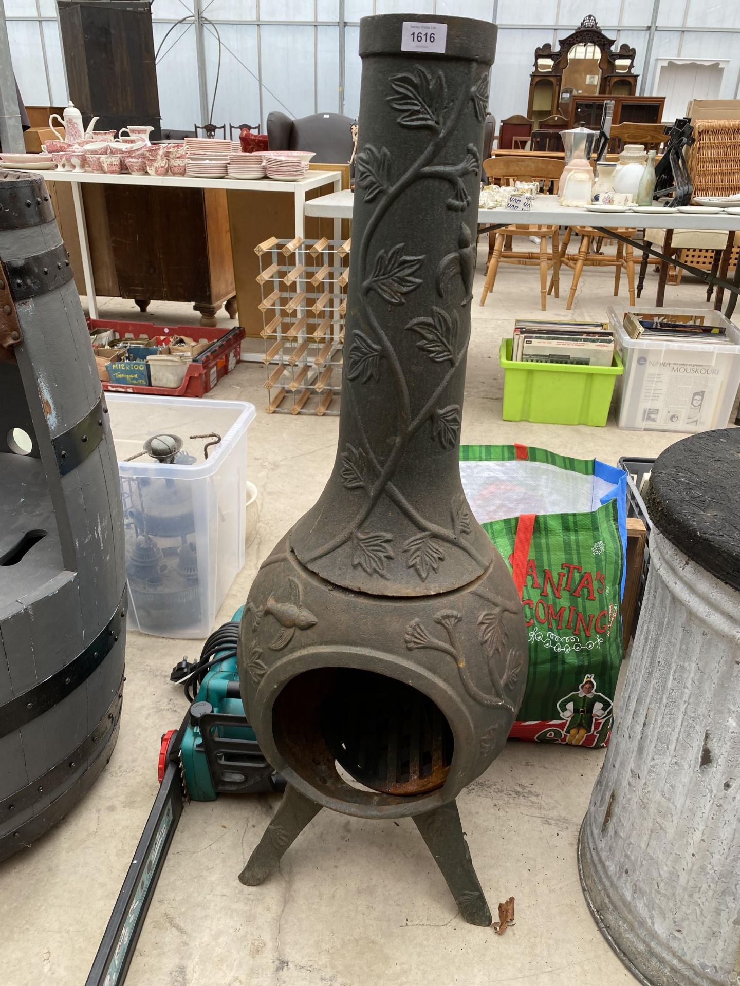 A DECORATIVE CAST IRON GARDEN CHIMENEA