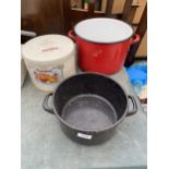 TWO ENAMEL COOKING POTS AND A VINTAGE TIN