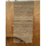 A BROWN WOVEN CARPET RUNNER