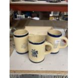 A GROUP OF THREE VINTAGE TANKARDS AND SMALL WOODEN CRATE
