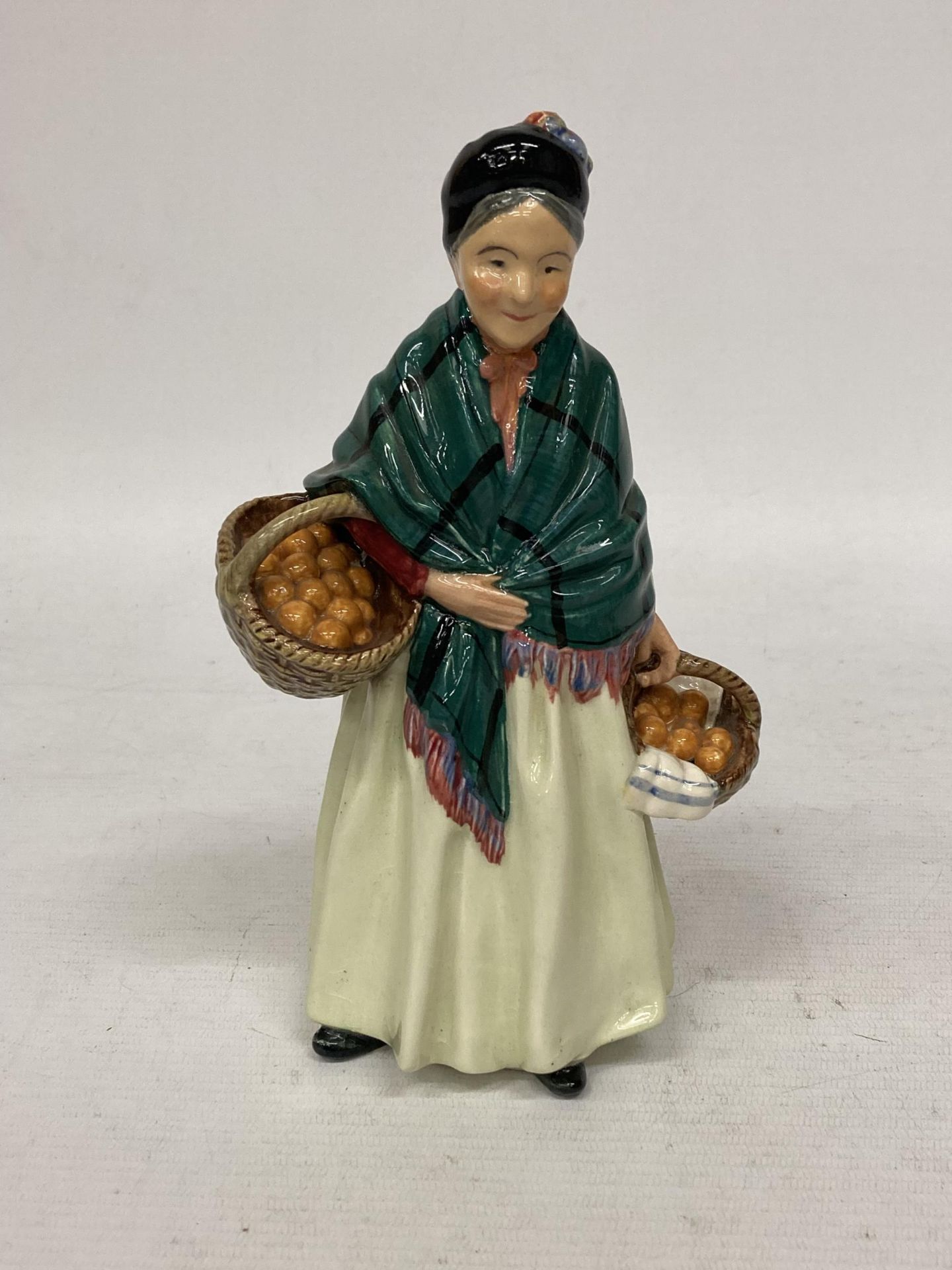 A ROYAL DOULTON FIGURINE HN 1953 "THE ORANGE LADY"