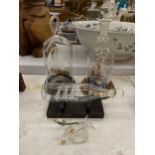 THREE GLASS SHIPS IN BOTTLES ON WOODEN BASES PLUS A GLASS DOLPHIN FIGURE