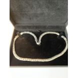 A SILVER FLAT LINK NECKLACE IN A PRESENTATION BOX