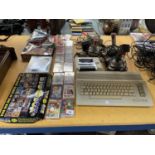 A VINTAGE COMMODORE 64 GAMES SYSTEM WITH JOYSTICKS, A DATASSETTE PLUS A QUANTITY OF GAMES TO INCLUDE