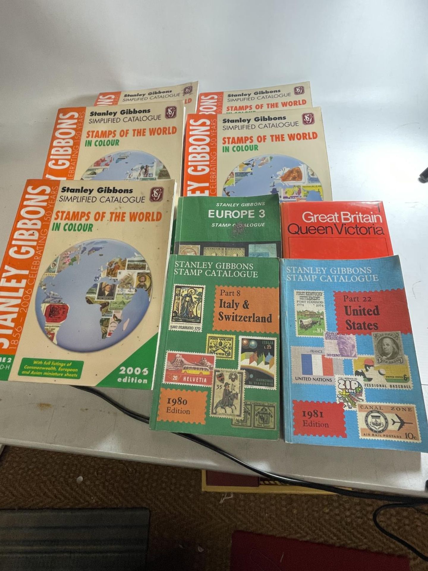 VOLUMES 1 - 5 OF THE 2006 EDITION OF STANLEY GIBBONS STAMP DIRECTORIES PLUS FOUR OTHER STAMP BOOKS