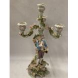 A CONTINENTAL DRESDEN PORCELAIN FIGURAL CANDLESTICK