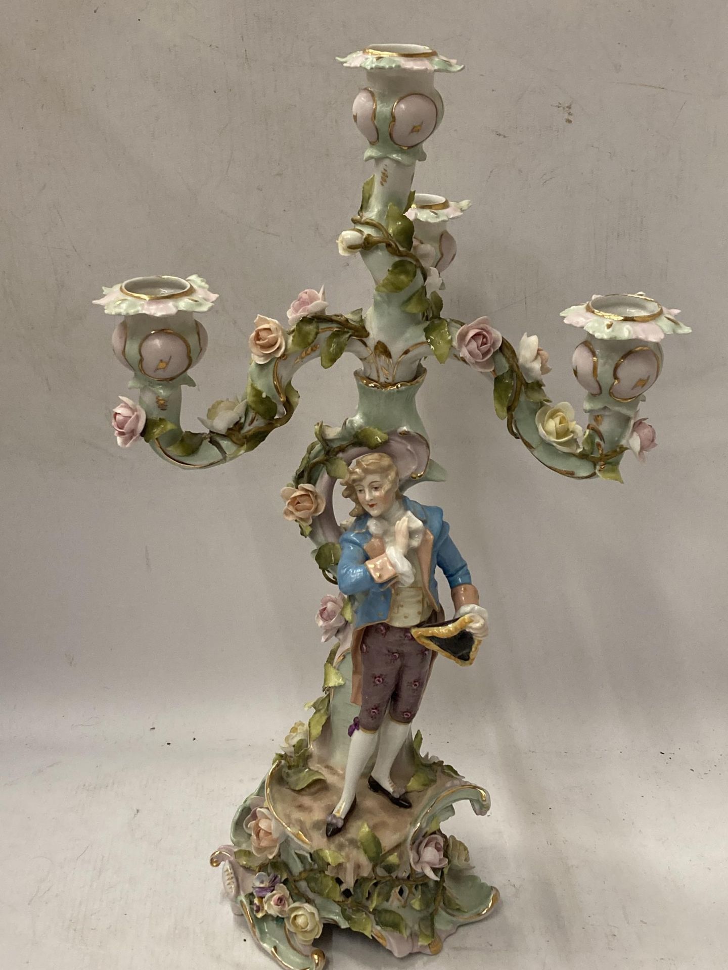 A CONTINENTAL DRESDEN PORCELAIN FIGURAL CANDLESTICK