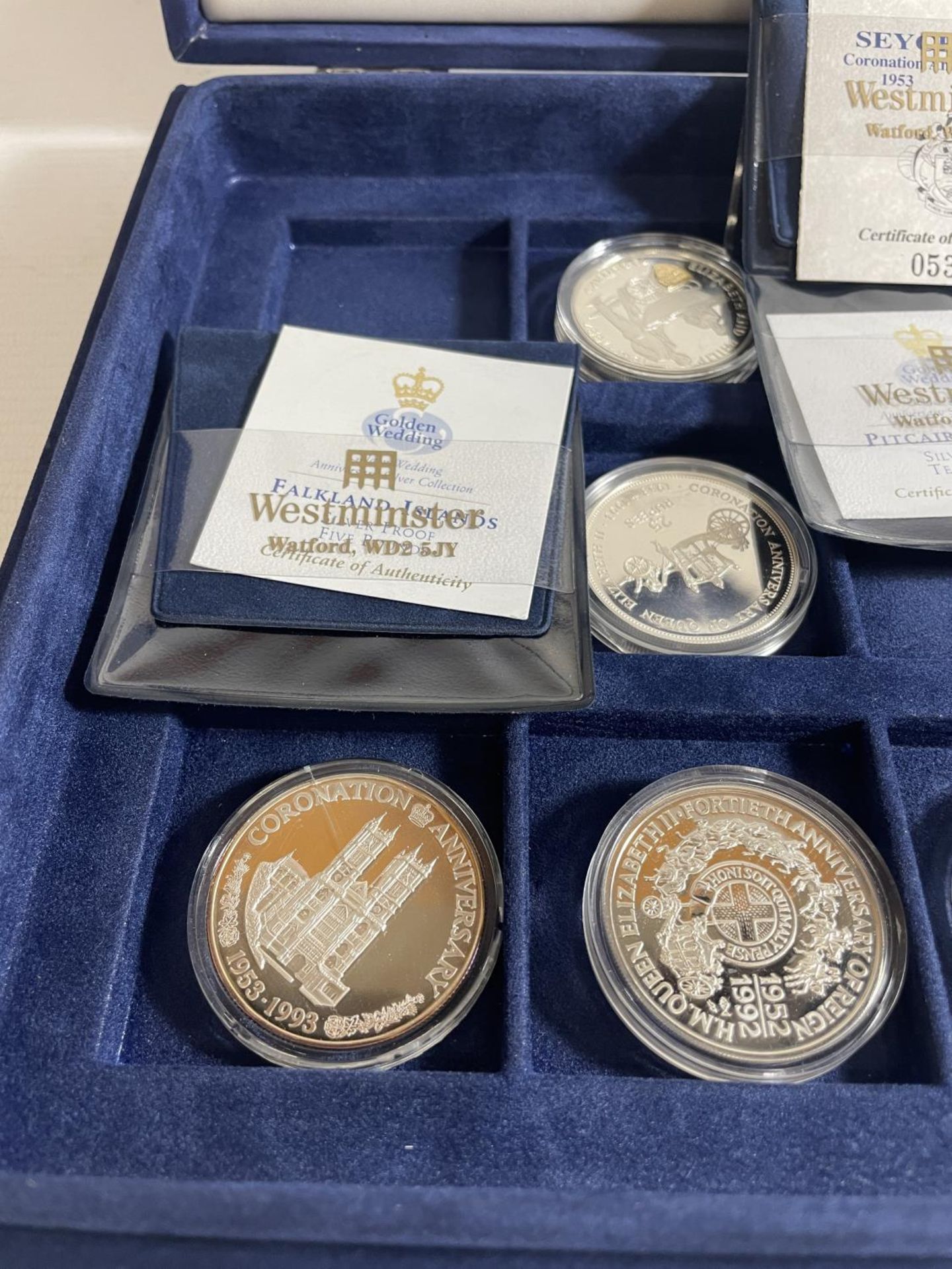 PRESENTATION CASE HOUSING ROYAL FAMILY COMMEMORATIVE COINS TO INCLUDE : PITCAIRN, FALKLANDS, - Image 2 of 3