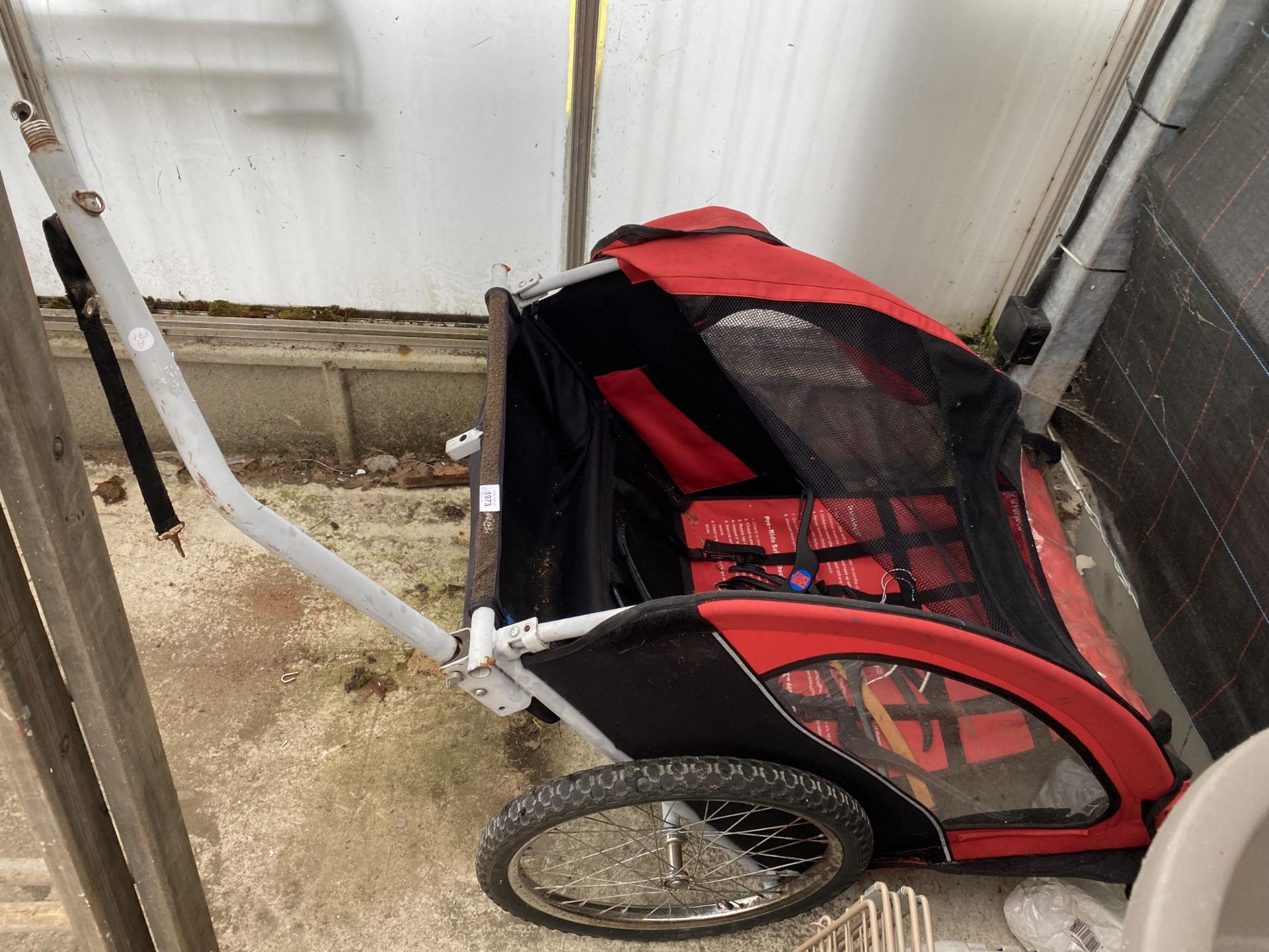 A CHILDRENS TWO SEATER BIKE TRAILER