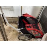 A CHILDRENS TWO SEATER BIKE TRAILER