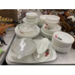 A LARGE QUANTITY OF PYREX STYLE DINNERWARE WITH ROSE PATTERN TO INCLUDE VARIOUS SIZES OF PLATES,
