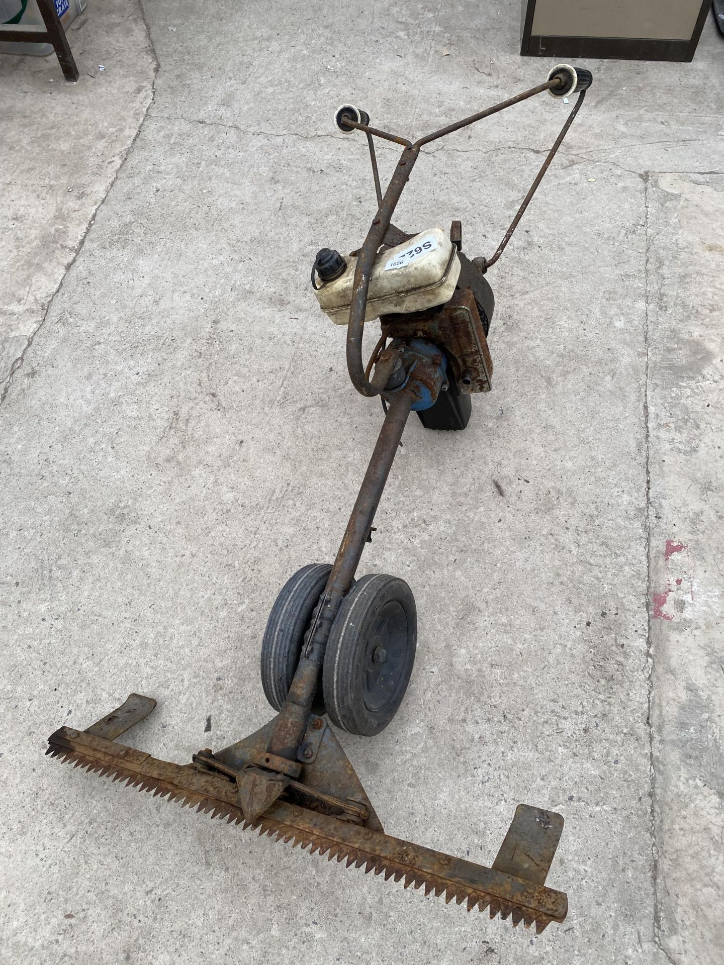 A VINTAGE PETROL ENGINE PUSH ALONG FINGER MOWER