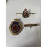 A MARKED 9 CARAT GOLD BAR WITH AN ENAMEL ROYAL CORPS ARMY BADGE AND A HALLMARKED BIRMINGHAM SILVER