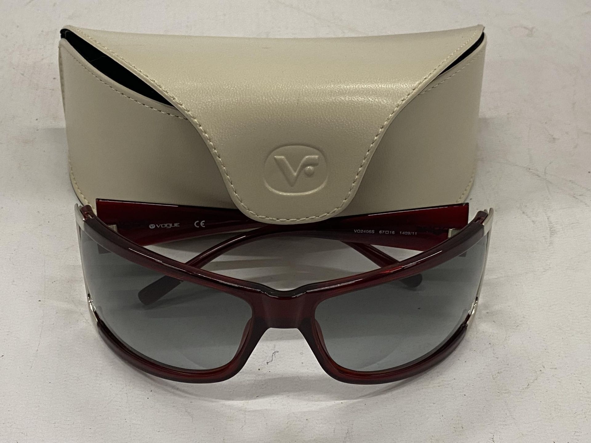 A PAIR OF VOGUE SUNGLASSES WITH CASE