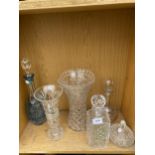 AN ASSORTMENT OF CUT GLASS ITEMS TO INCLUDE DECANTORS AND VASES ETC