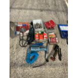 AN ASSORTMENT OF TOOLS TO INCLUDE VEHICLE LIGHT BULBS, A HEAT GUN AND A COMPRESSOR ATTATCHMENT ETC