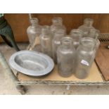 AN ASSORTMENT OF GLASS VESSELS AND A METAL BOWL