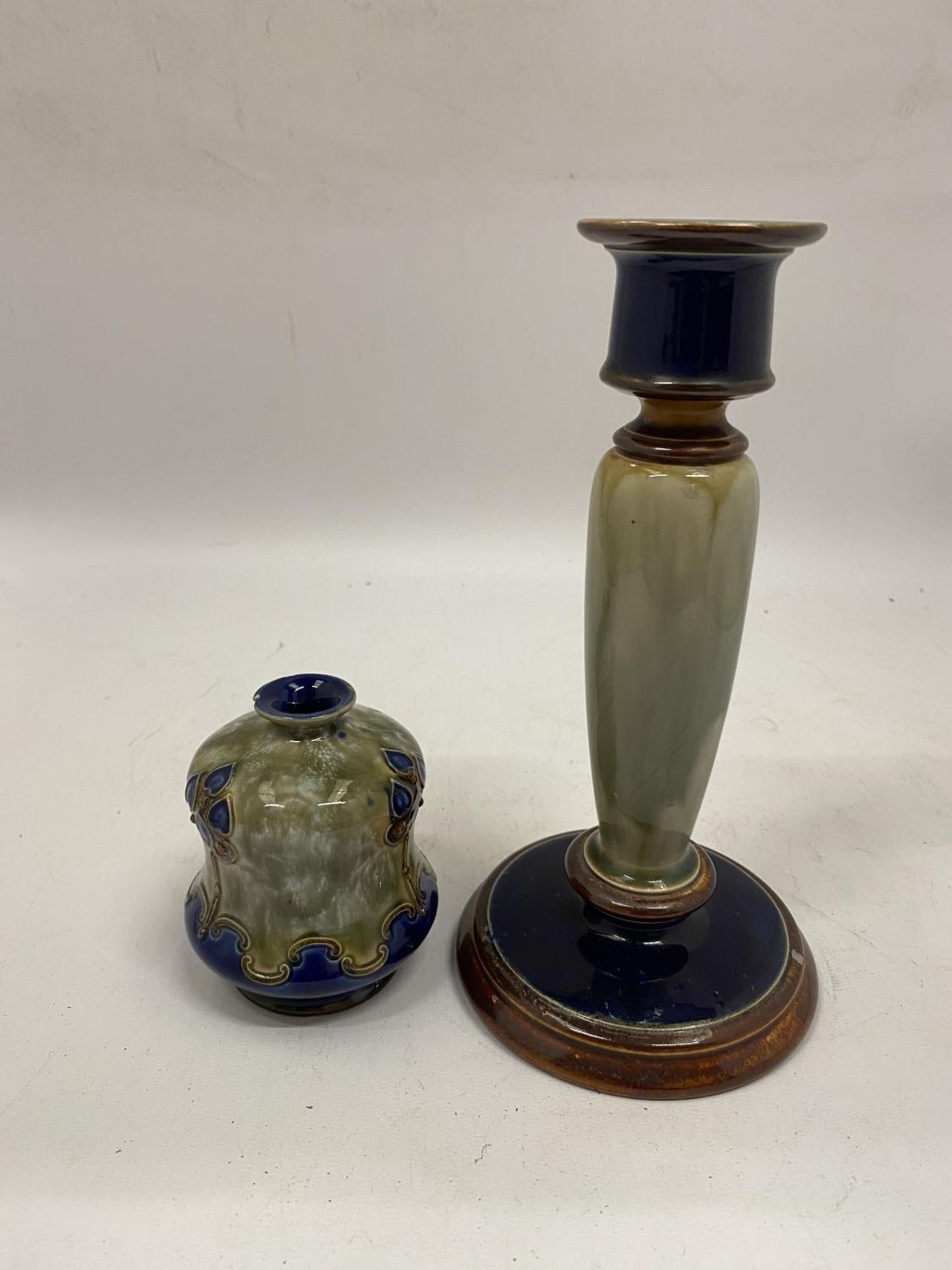 TWO PIECES OF ROYAL DOULTON STONEWARE TO INCLUDE A CANDLESTICK AND A SMALL VASE