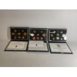 THREE UK PROOF COIN SETS , 1986 , 2 X 1990 .