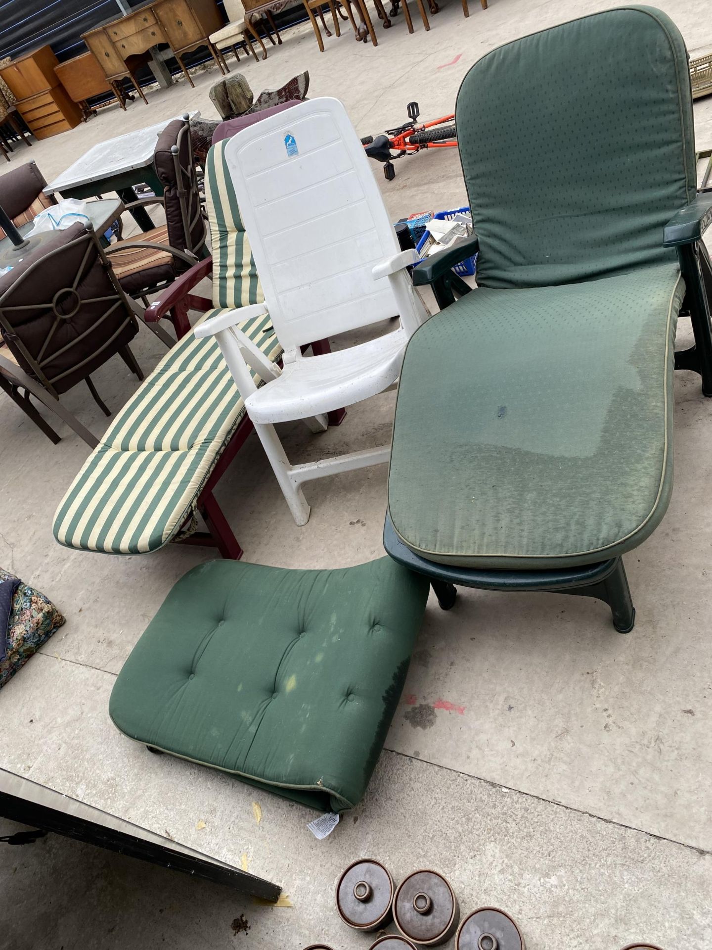 THREE VARIOUS PLASTIC SUN LOUNGERS TWO WITH CUSHIONS
