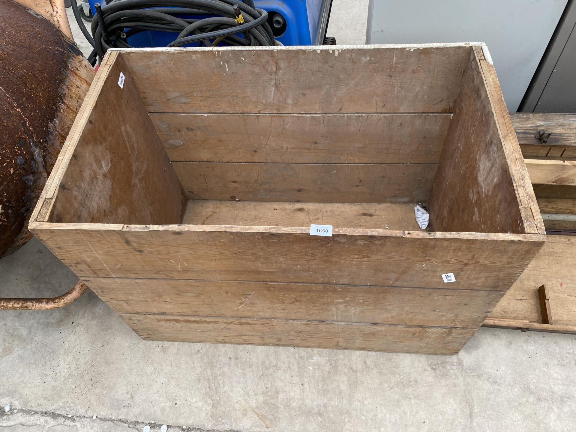 A LARGE WOODEN CRATE