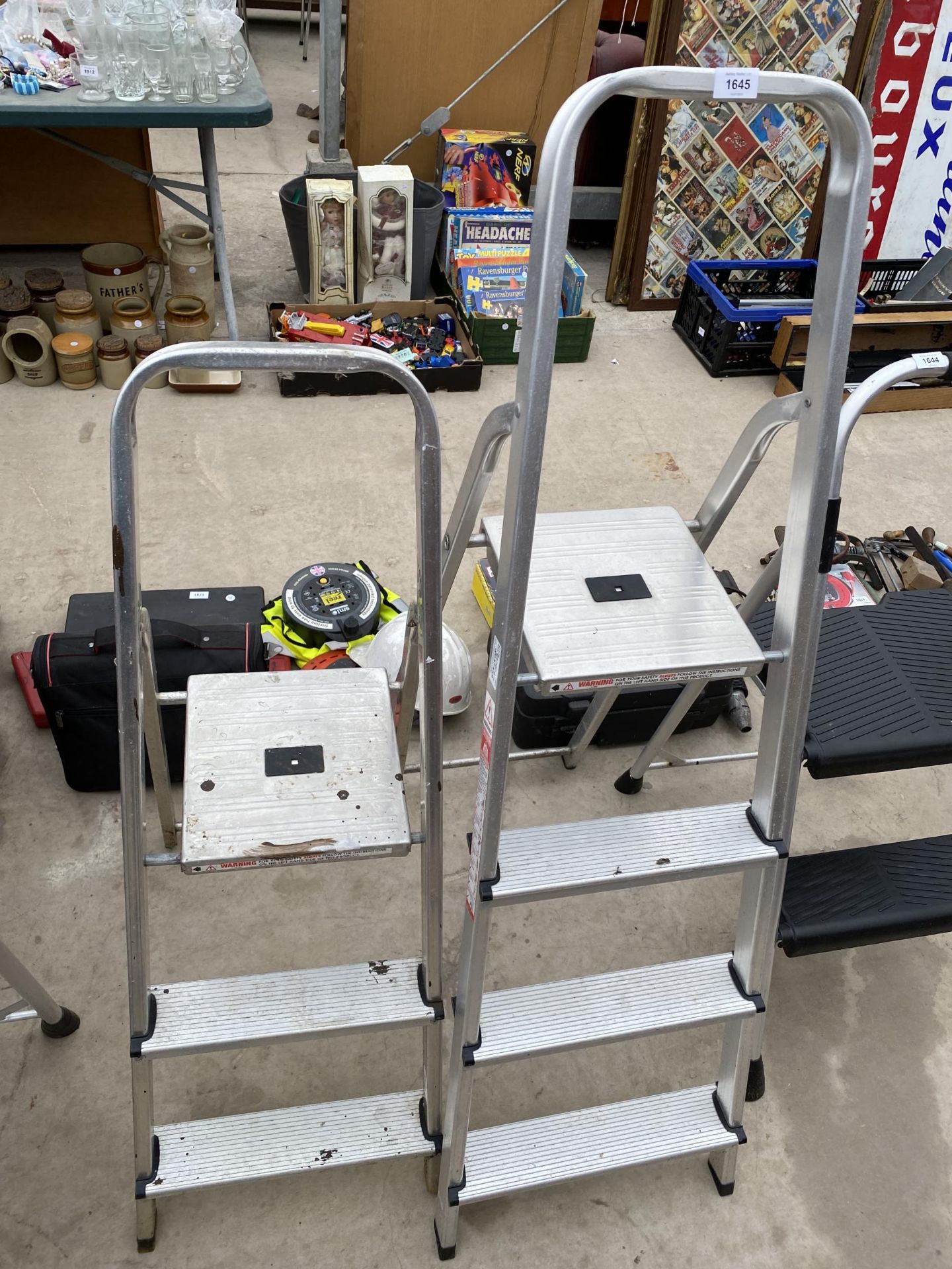 A THREE RUNG ALUMINIUM STEP LADDER AND A FURTHER TWO RUNG ALUMINIUM STEP LADDER