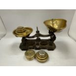 A VINTAGE SET OF WEIGHING SCALES AND BRASS WEIGHTS