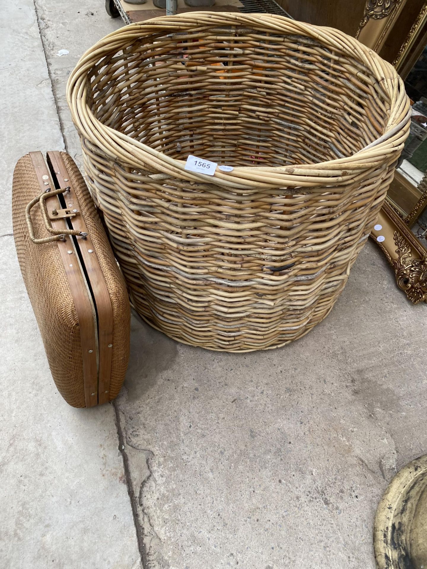 A LARGE WICKER LOG BASKET