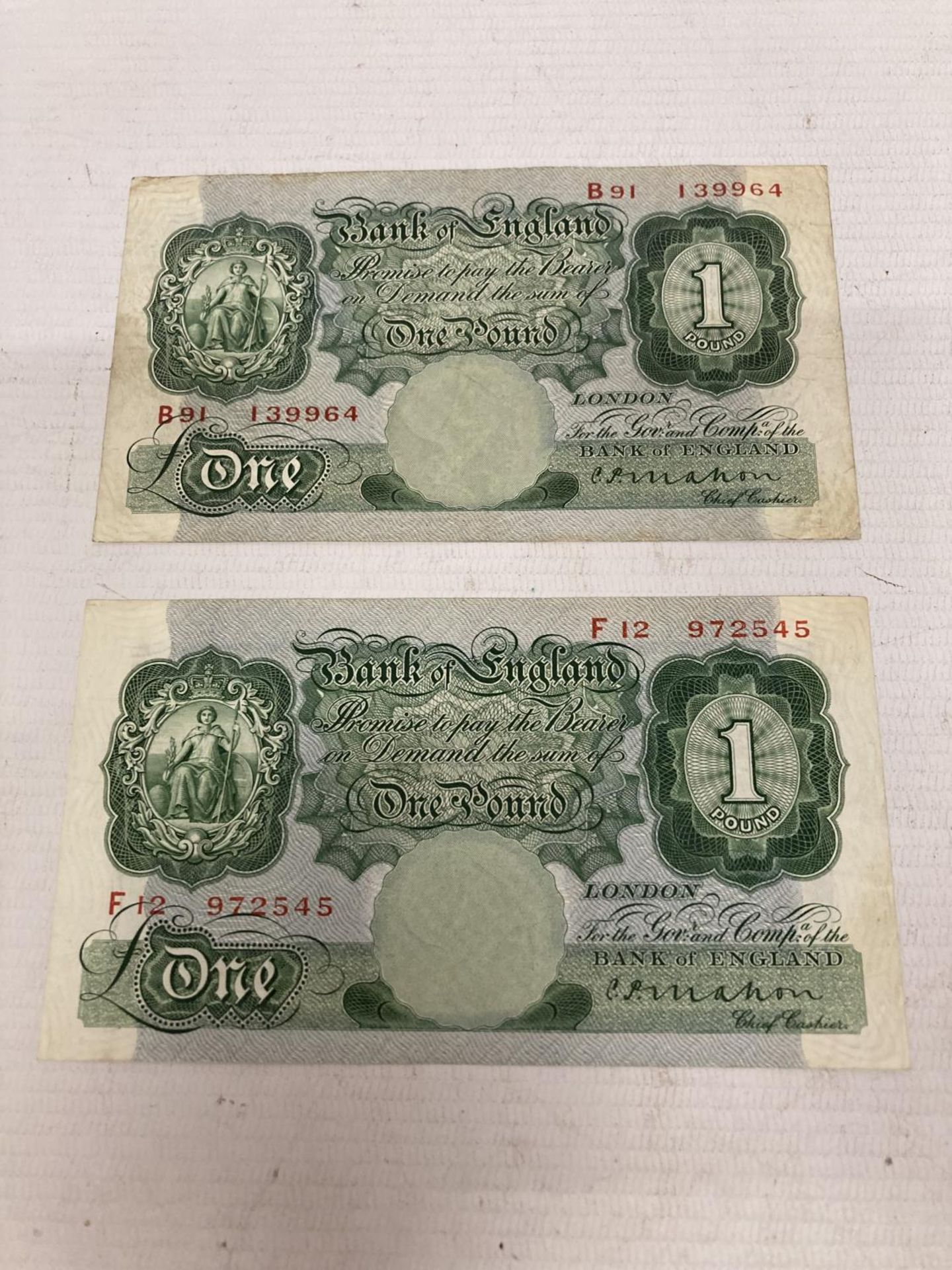 TWO BANK OF ENGLAND ONE POUND NOTES SIGNED MAHON (1925-1929)