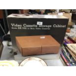 A VINTAGE VIDEO CASSETTE STORAGE CABINET - BOXED