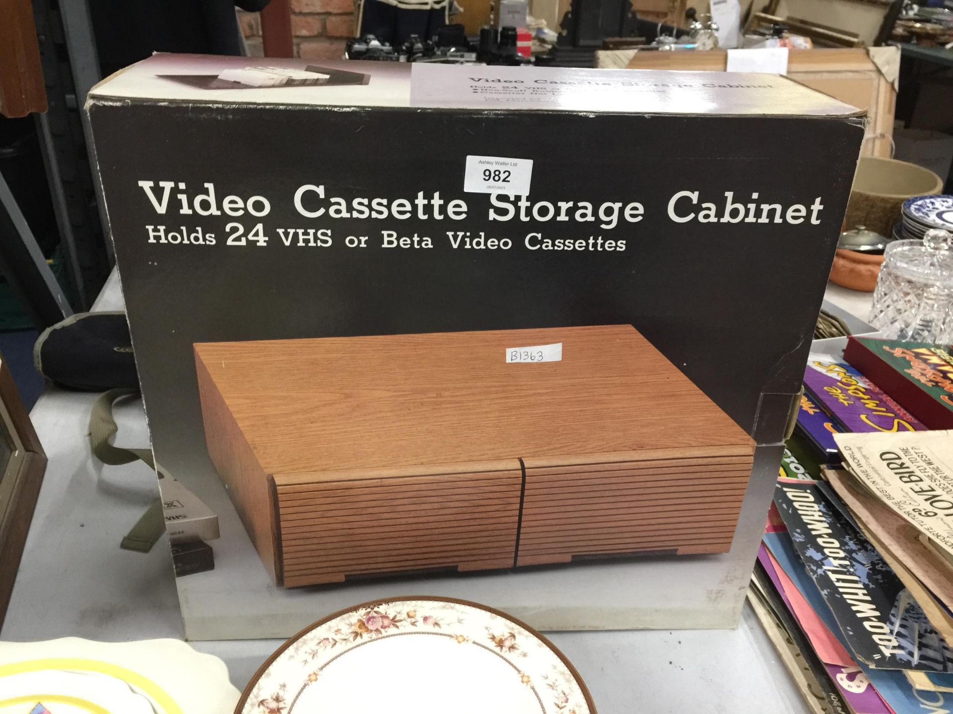 A VINTAGE VIDEO CASSETTE STORAGE CABINET - BOXED