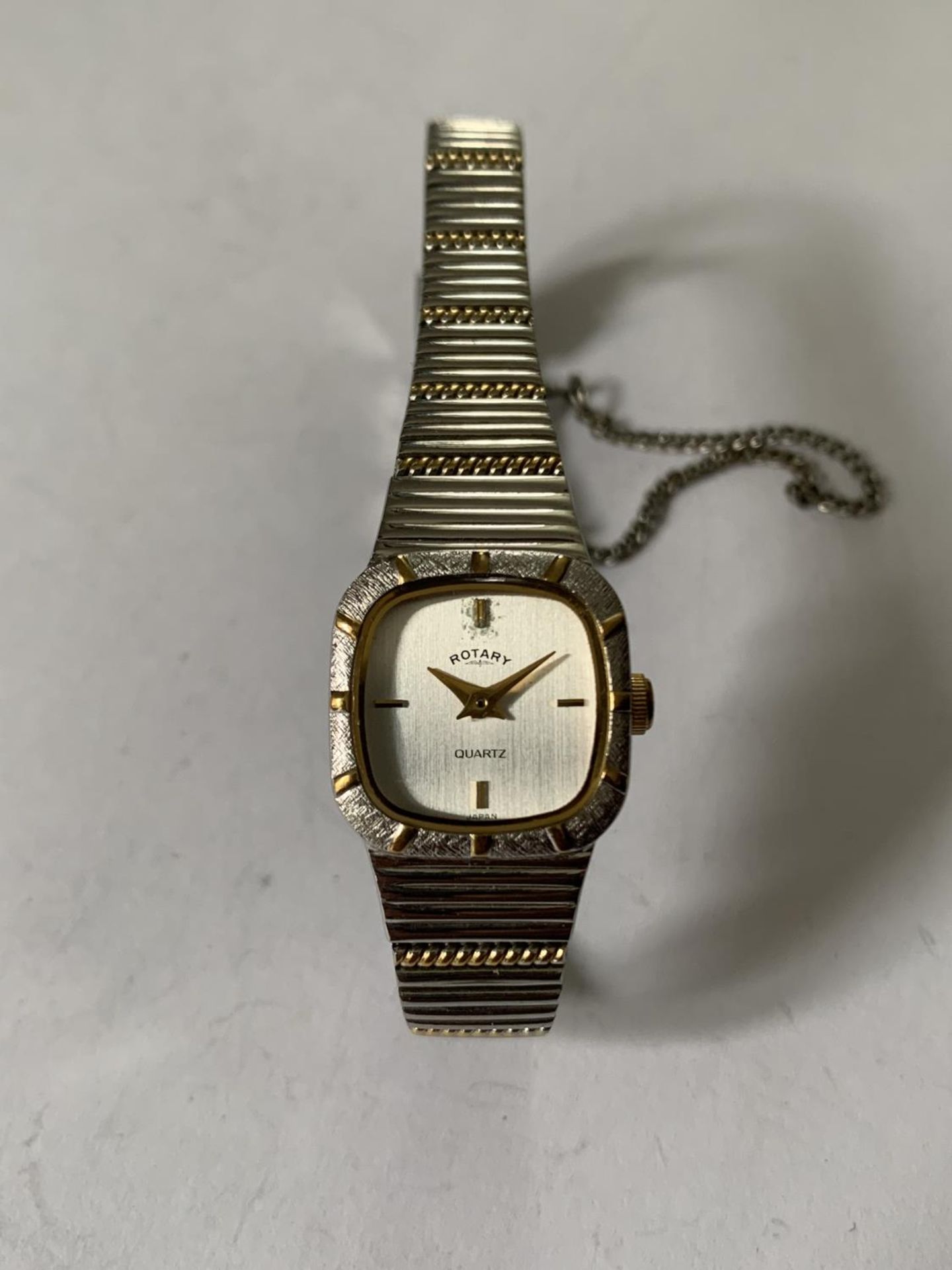 A ROTARY WHITE AND YELLOW METAL STRAP WRIST WATCH IN NEED OF BATTERY