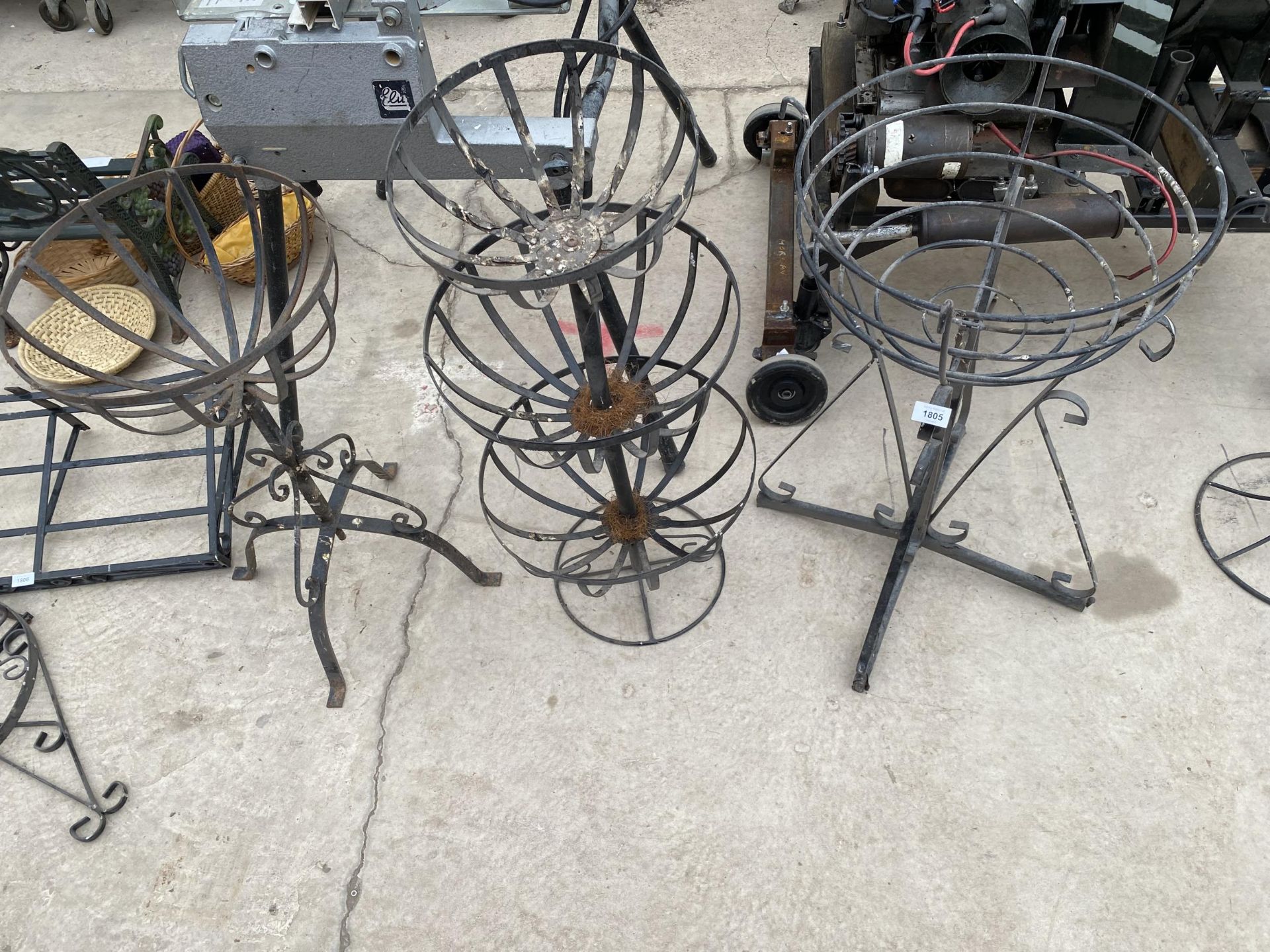 THREE VARIOUS WROUGHT IRON BASKET PLANT STANDS