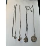 FOUR SILVER NECKLACES WITH PENDANTS