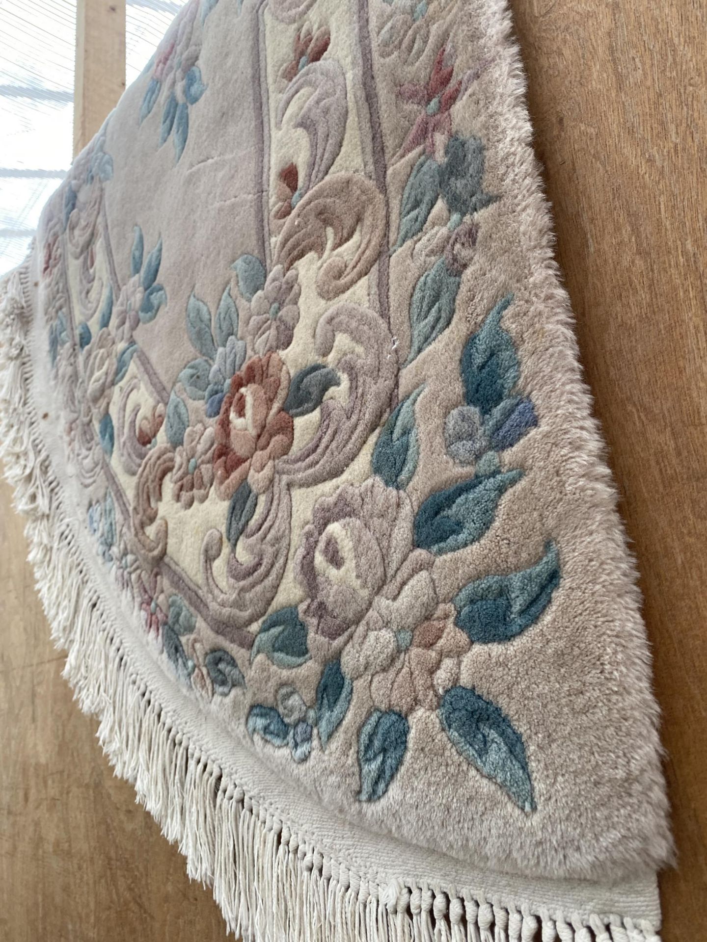 A CREAM HALF MOON FRINGED RUG - Image 2 of 2