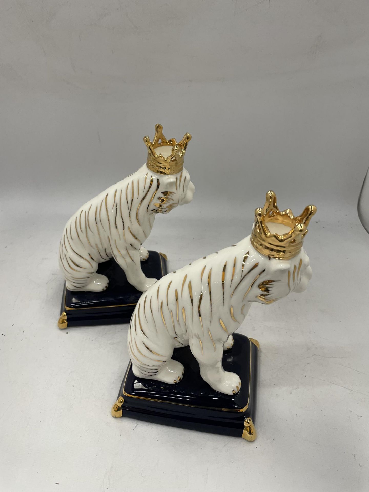 A PAIR OF GILT POTTERY LION FIGURES - Image 2 of 3