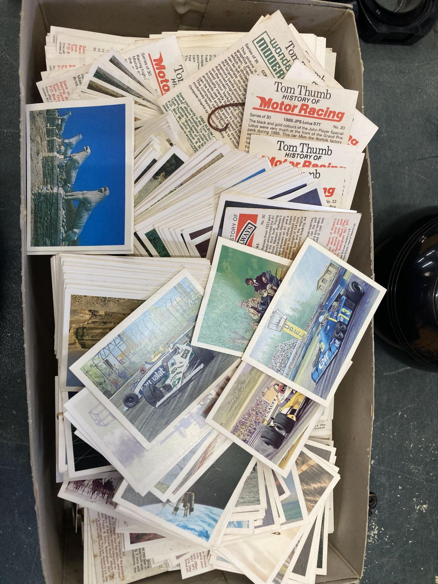 A BOX OF ASSORTED POSTCARDS
