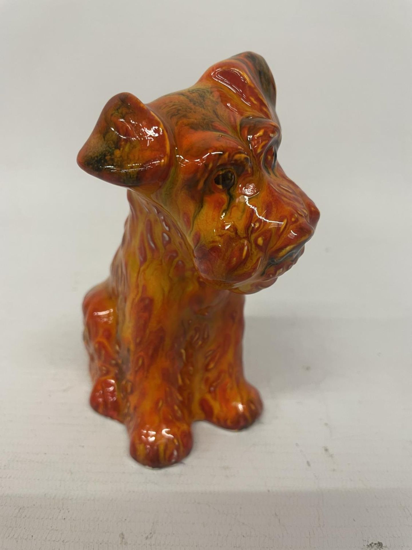 AN ANITA HARRIS TERRIER DOG FIGURE HAND PAINTED AND SIGNED IN GOLD