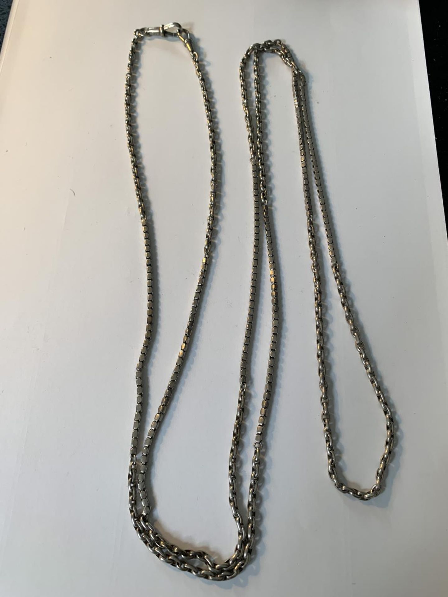 A MUFF CHAIN WITH TWO DESIGNS LENGTH 60 INCHES
