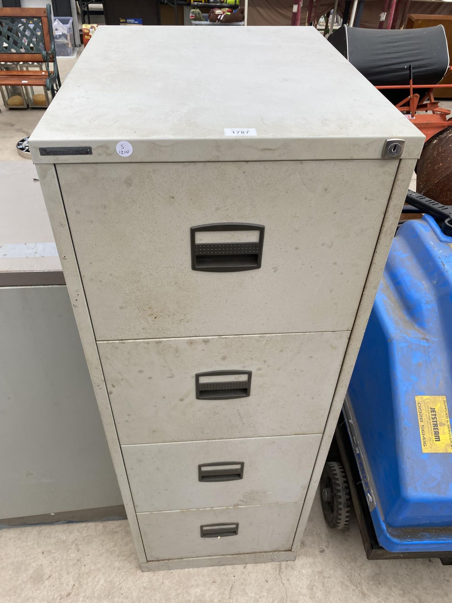 A FOUR DRAWER METAL FILING CABINET