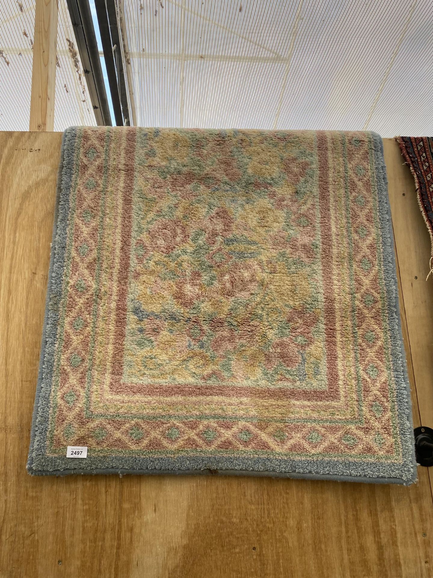 A MODERN COLOURFUL PATTERNED RUG