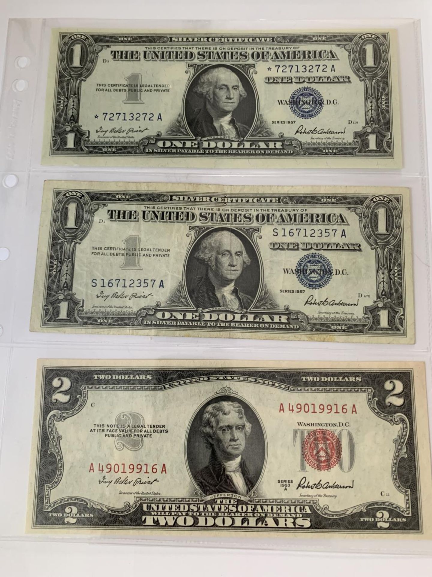 THREE THE UNITED STATES OF AMERICA NOTES SIGNED ANDERSON (1957-1961) TO INCLUDE TWO ONE DOLLAR AND A