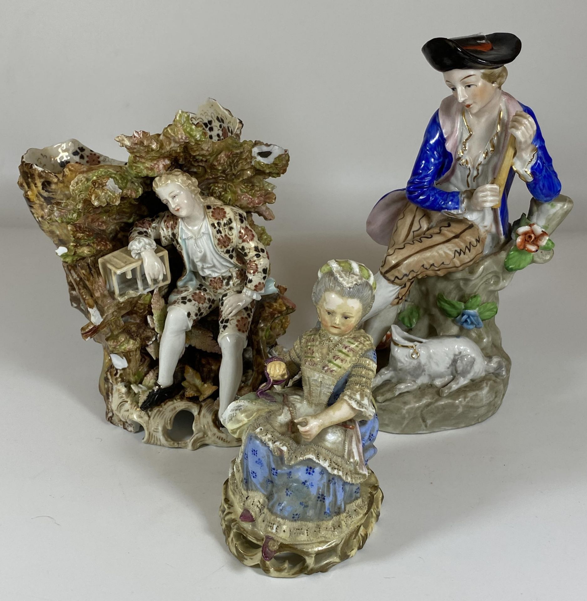 A GROUP OF THREE ANTIQUE CONTINENTAL PORCELAIN FIGURES TO INCLUDE GIRL WITH MEISSEN CROSS SWORDS