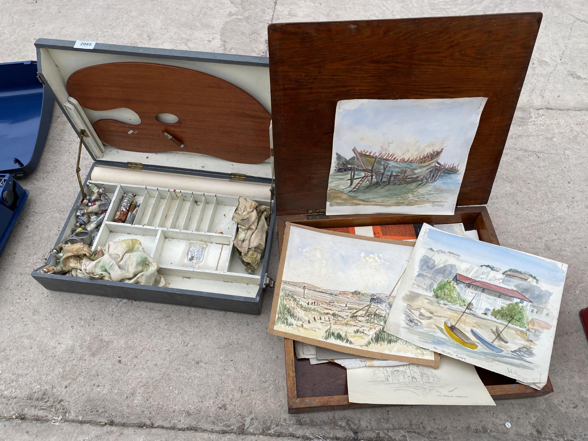 TWO WOODEN CASES CONTAINING ARTIST ITEMS TO INCLUDE PAINTS AND PICTURES ETC