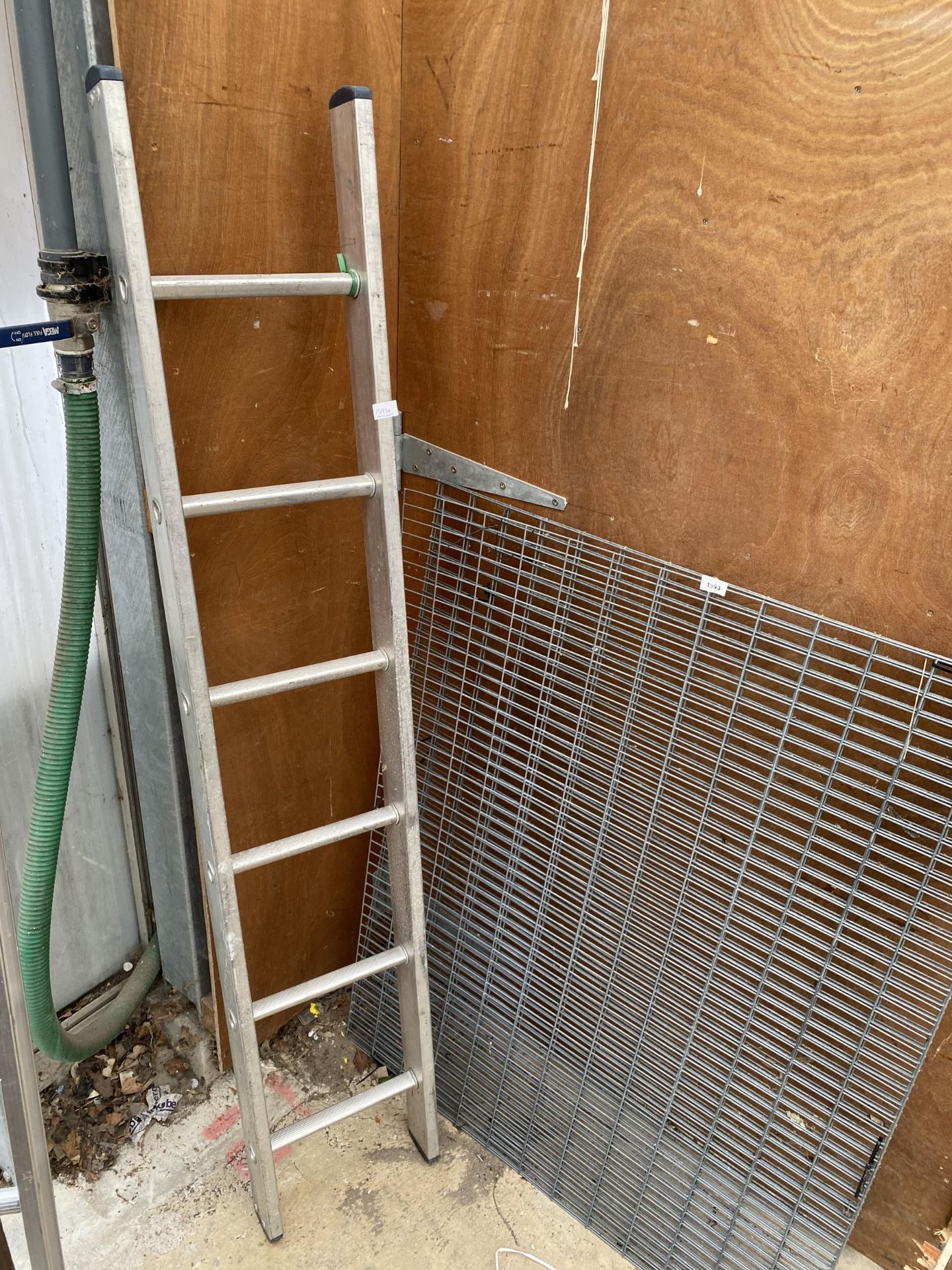 A SIX RUNG ALUMINIUM LADDER