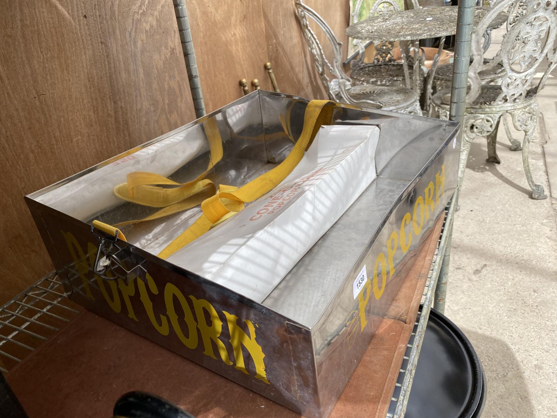 A METAL POPCORN SELLERS TRAY