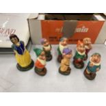 A POTTERY SET OF SNOW WHITE AND THE SEVEN DWARFS