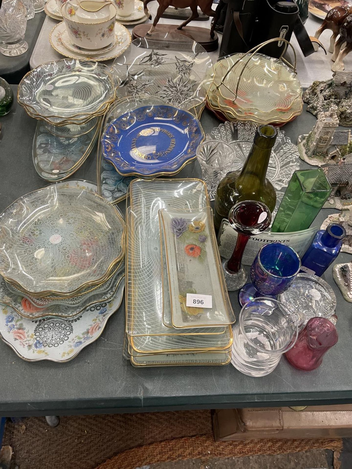A LARGE QUANTITY OF PATTERNED GLASSWARE PLATES AND SANDWICH TRAYS, ETC
